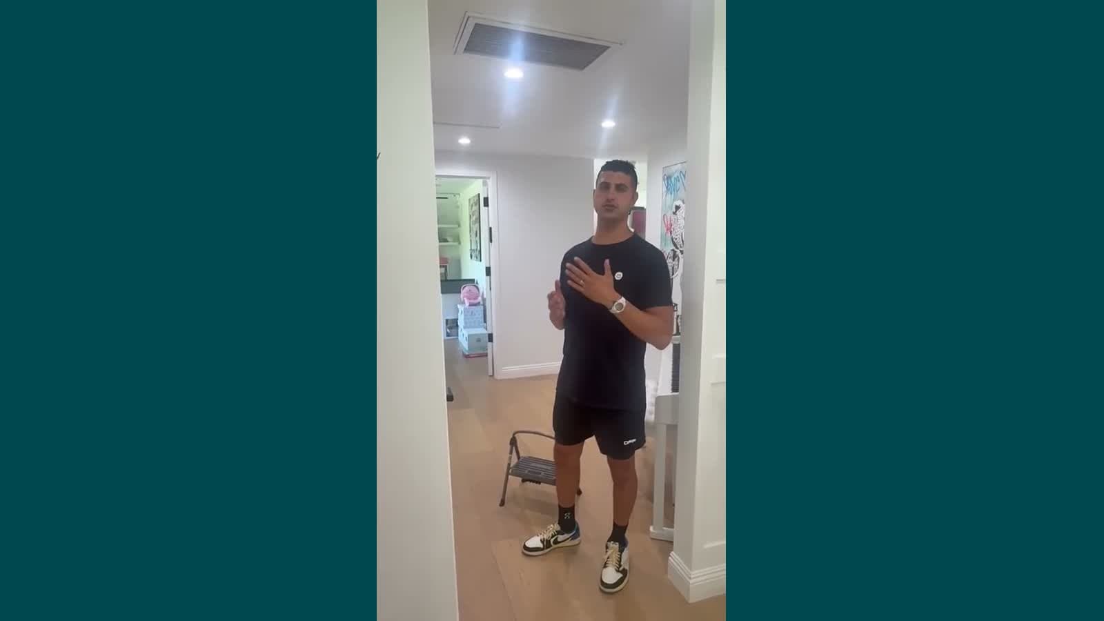 Course video preview: instructor standing in a home hallway